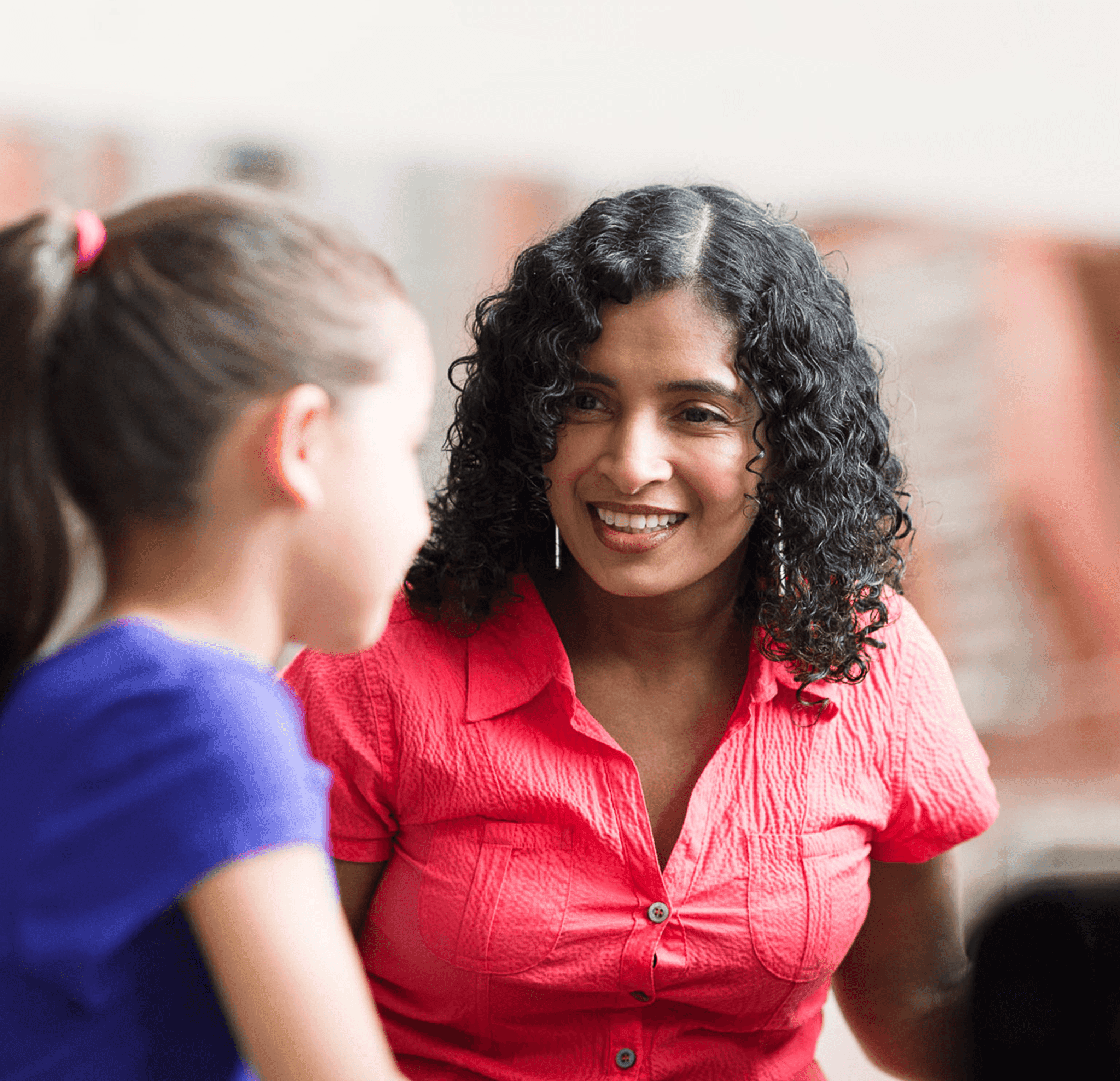 pupil has conversation with her teacher