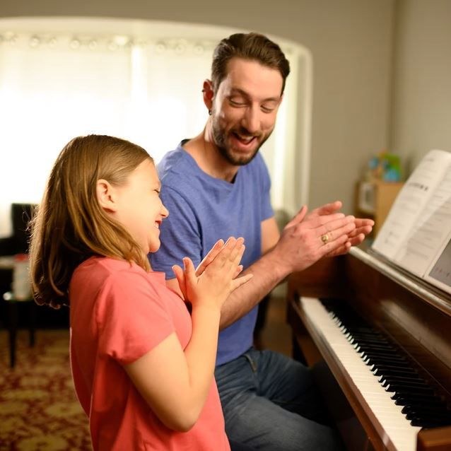 Girl is happy having success playing piano