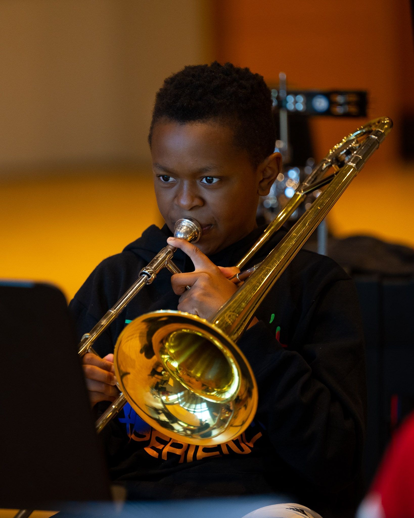 boy playing trumpet