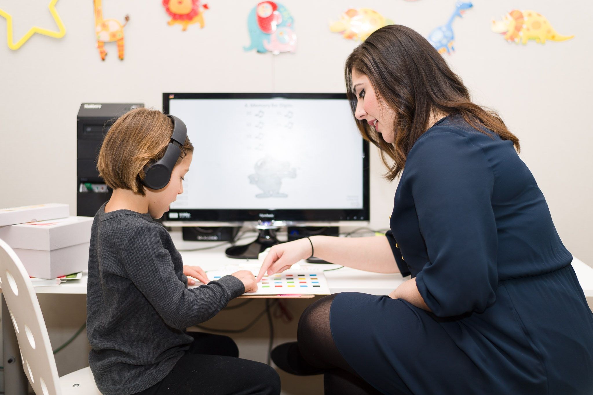 Teacher giving a lesson to child