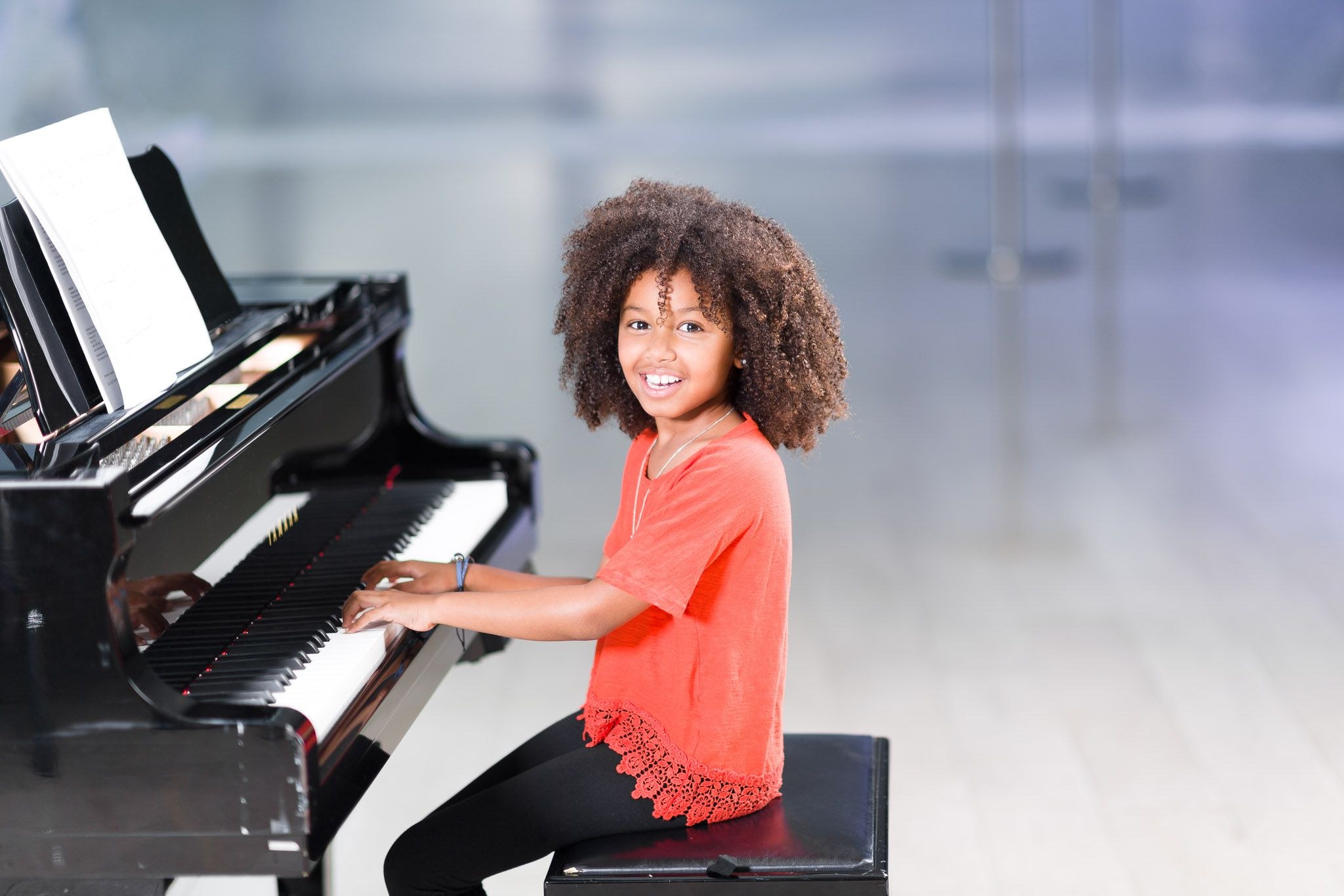 young girl playing piano