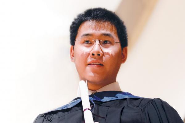 student taking a break from playing instrument