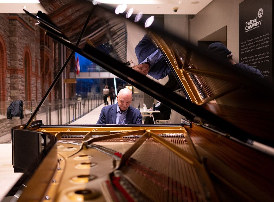 James Anagnoson, Dean of The Glenn Gould School, plays the new Steinway piano after it is delivered to the RCM.