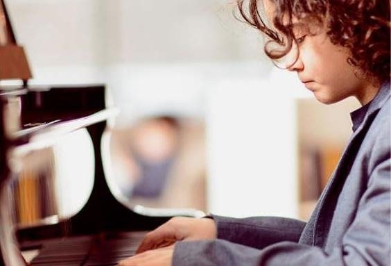 child playing piano