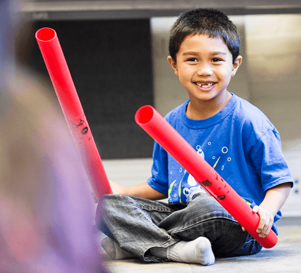 boy holding props
