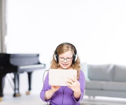 little girl wearing headphones